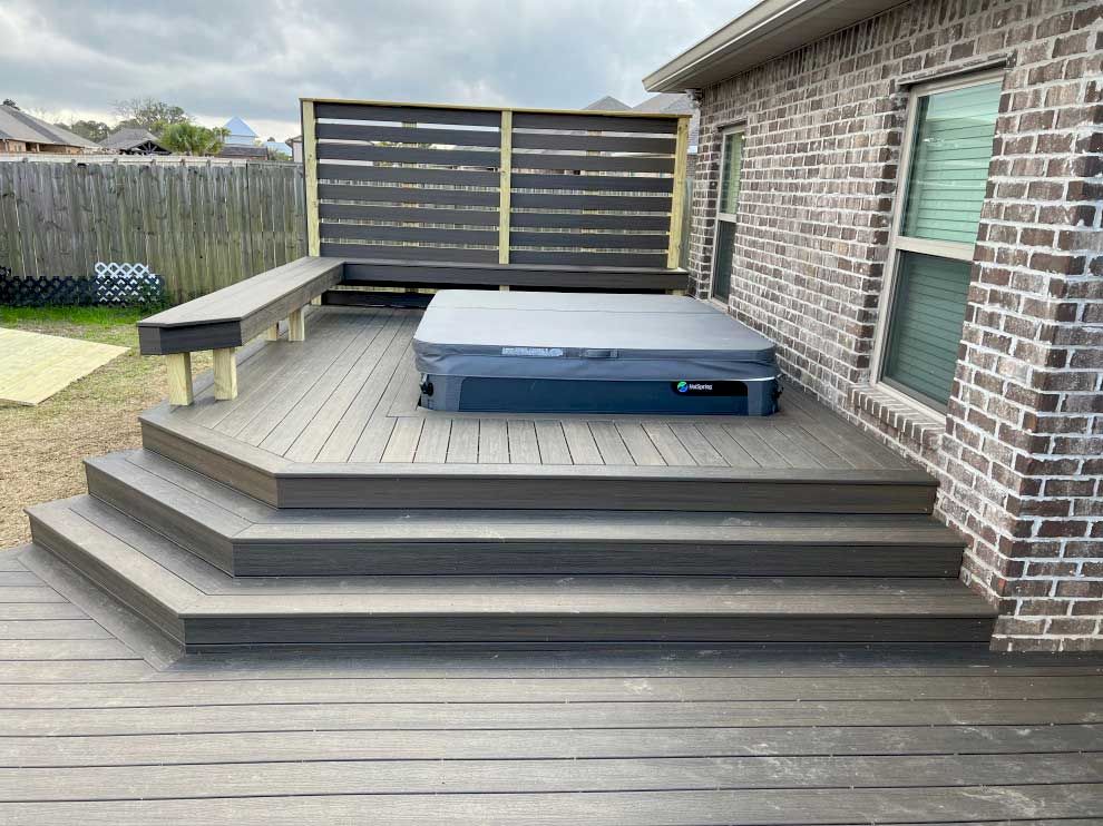 A hot tub built into a deck.