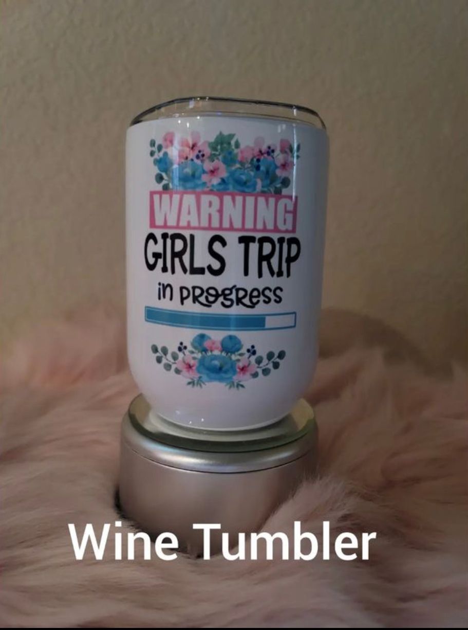 A wine tumbler that says warning girls trip in progress