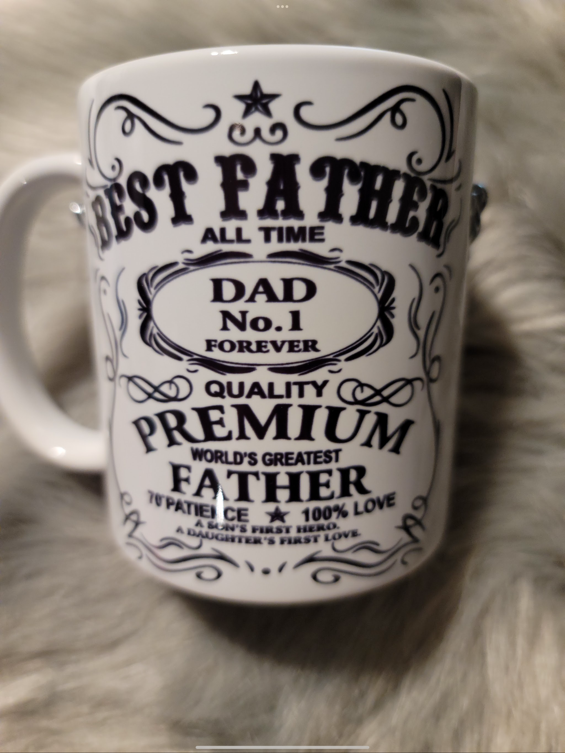 A mug that says best father all time dad no. 1 forever