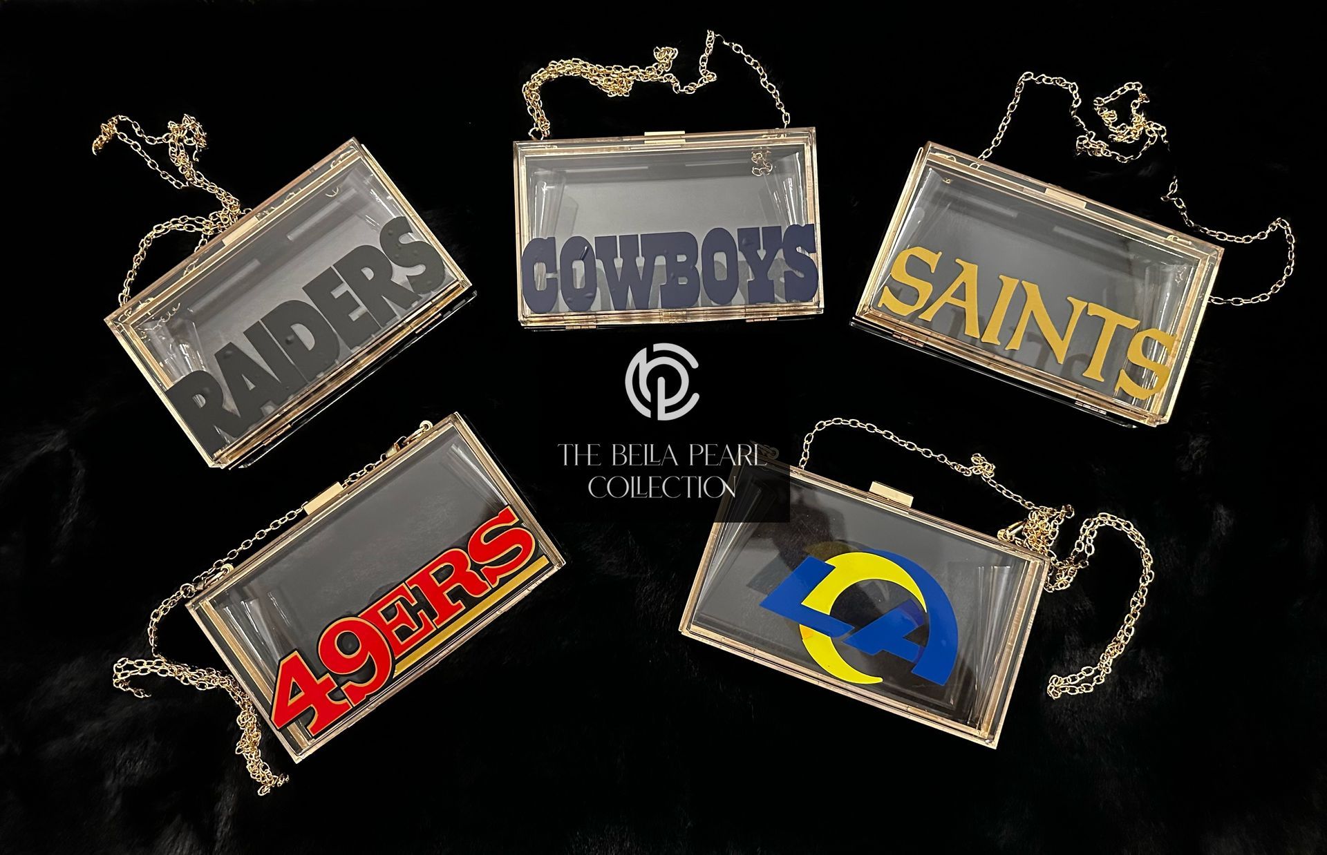 A group of clear purse with the name/logo of sports teams on them