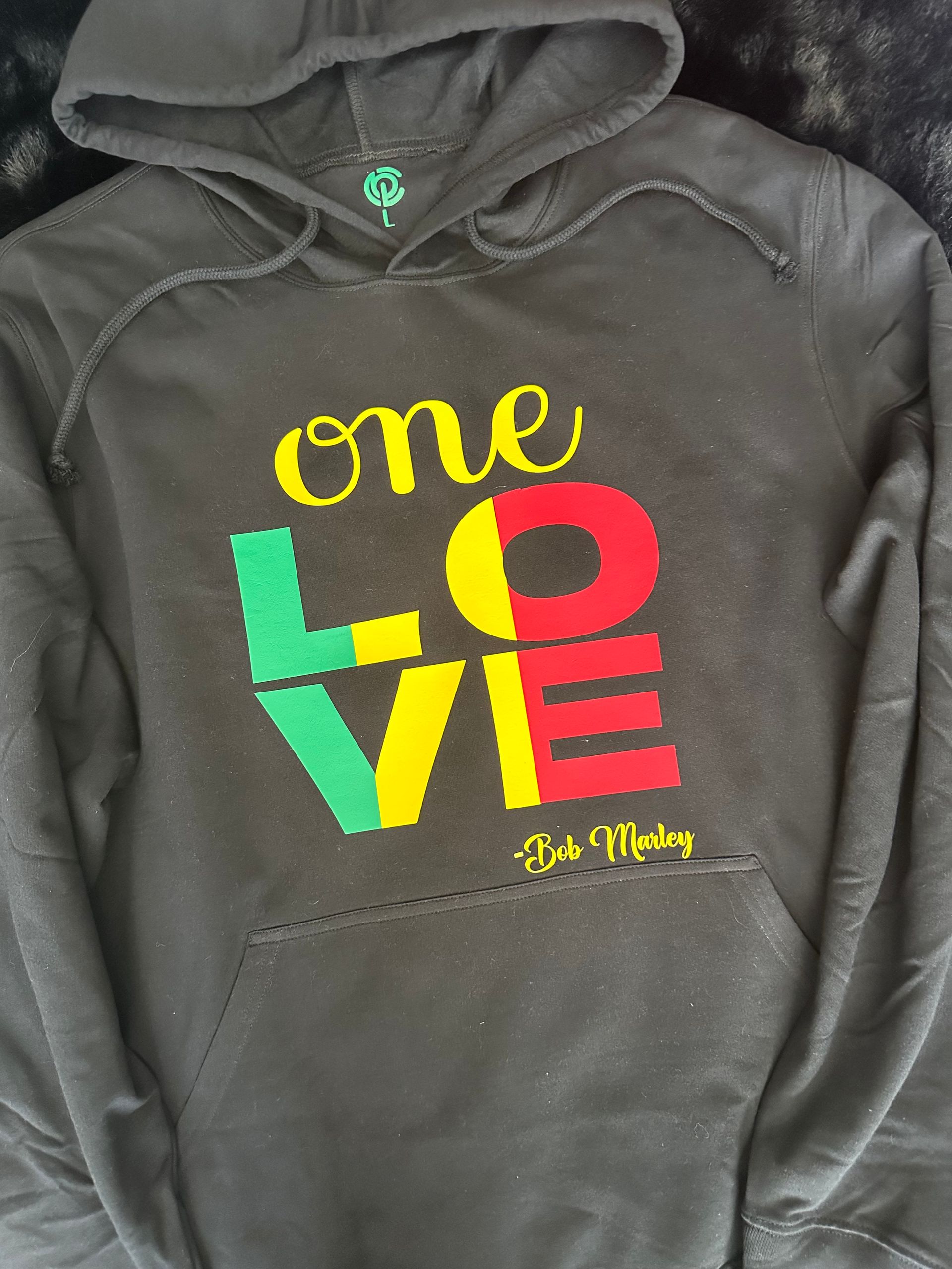 A hoodie that says one love on it