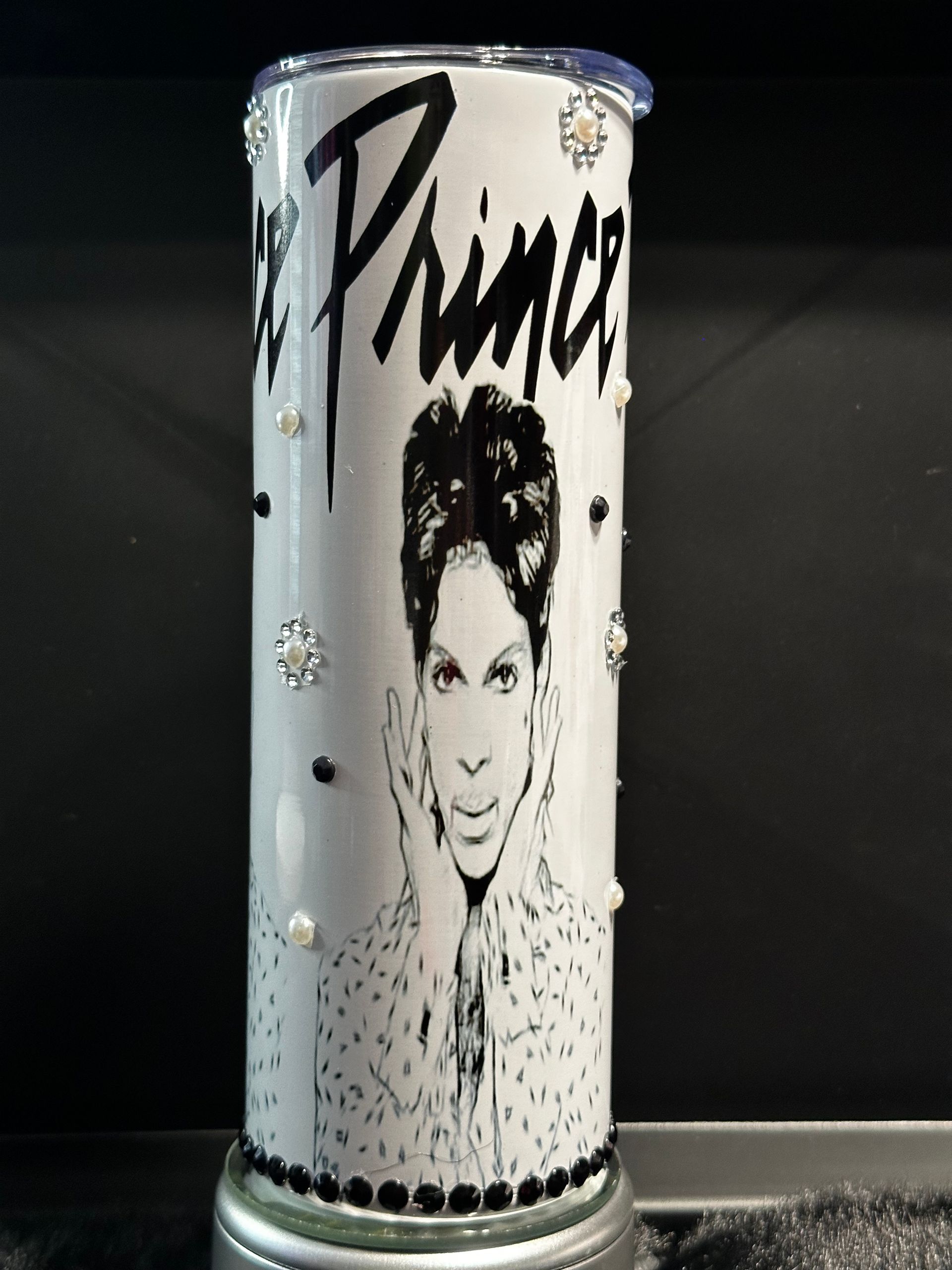 A black and white image of prince on a tumbler
