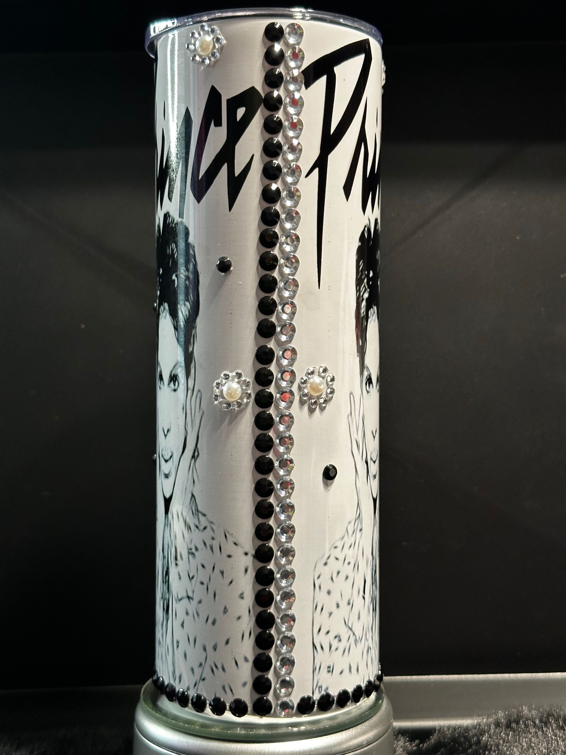 A black and white image of prince on a tumbler