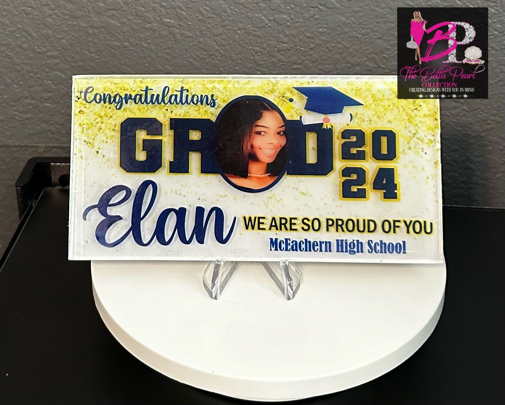 A plaque that says congratulations grade 20 elan we are so proud of you
