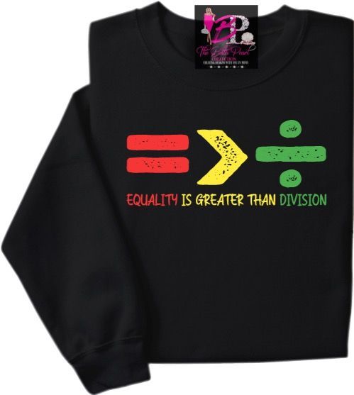 A black shirt that says equality is greater than division