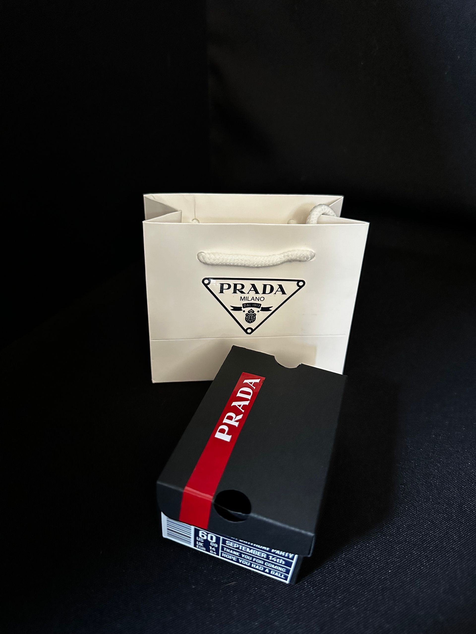 A black and white themed chanel favor bag and shoebox