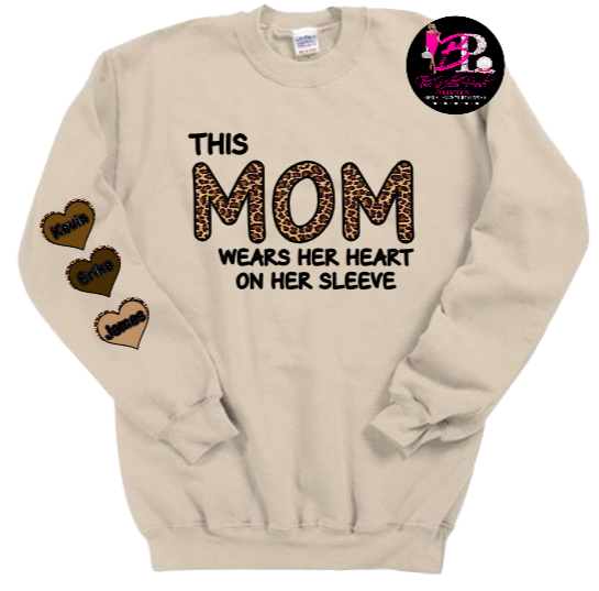 A sweatshirt that says this mom wears her heart on her sleeve