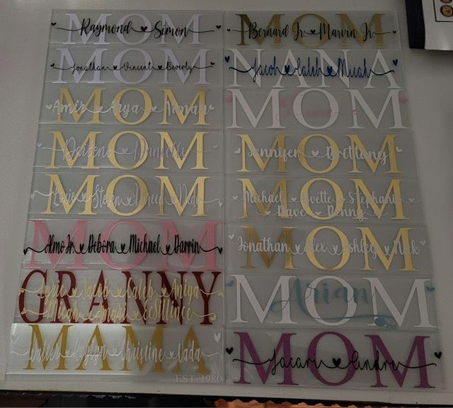 A display of personalized mother's day glass tiles