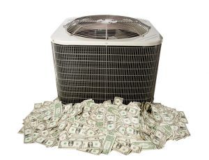 Air conditioner surrounded by a pile of dollar bills, suggesting high electricity costs
