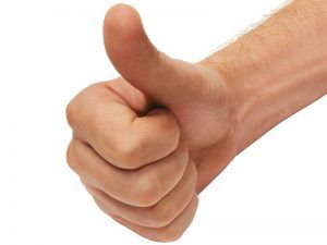 Hand giving a thumbs-up gesture against a white background