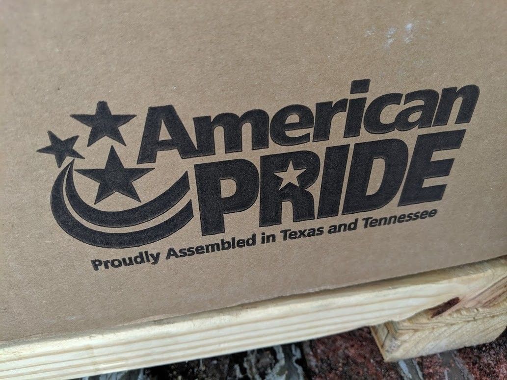 American Pride logo printed on cardboard, black text with stars and crescent