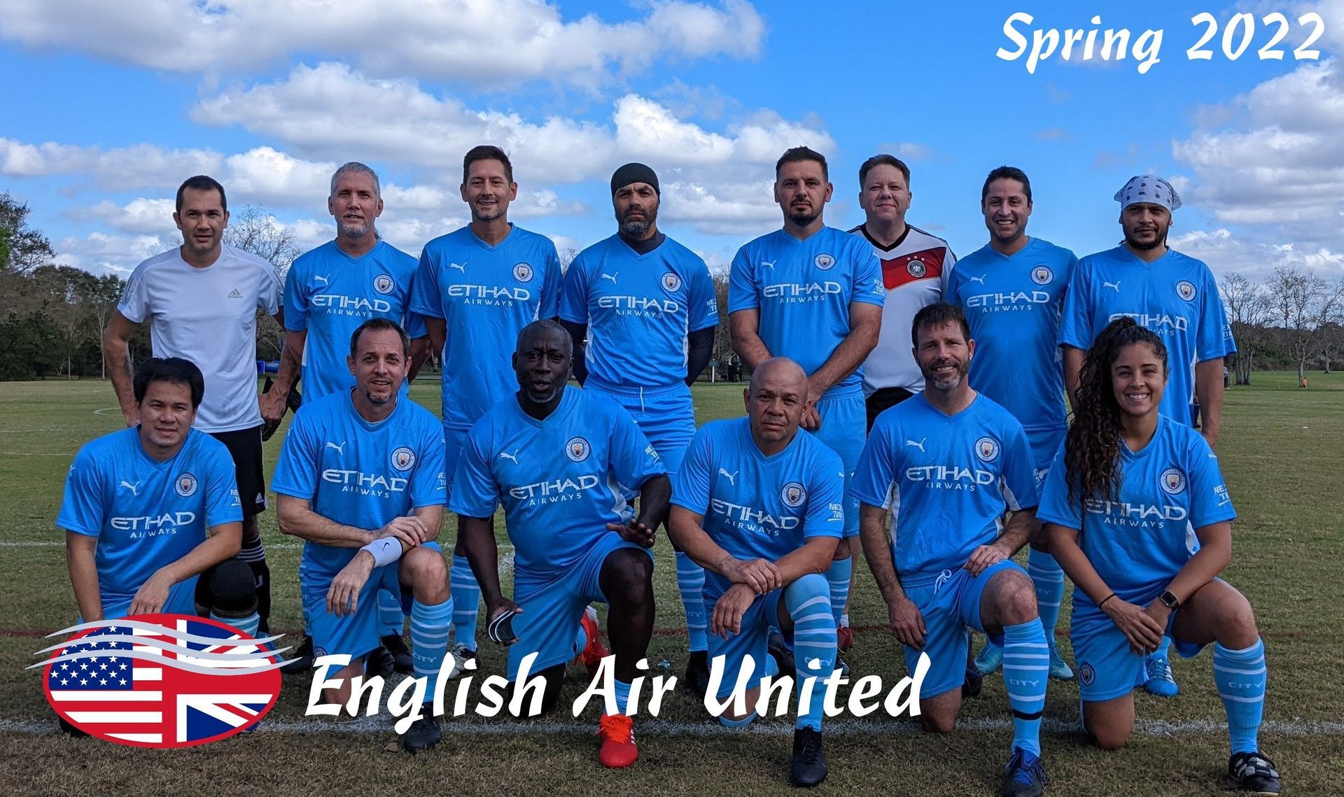 English Air United soccer team in blue jerseys posing outdoors, with “Spring 2022” text.