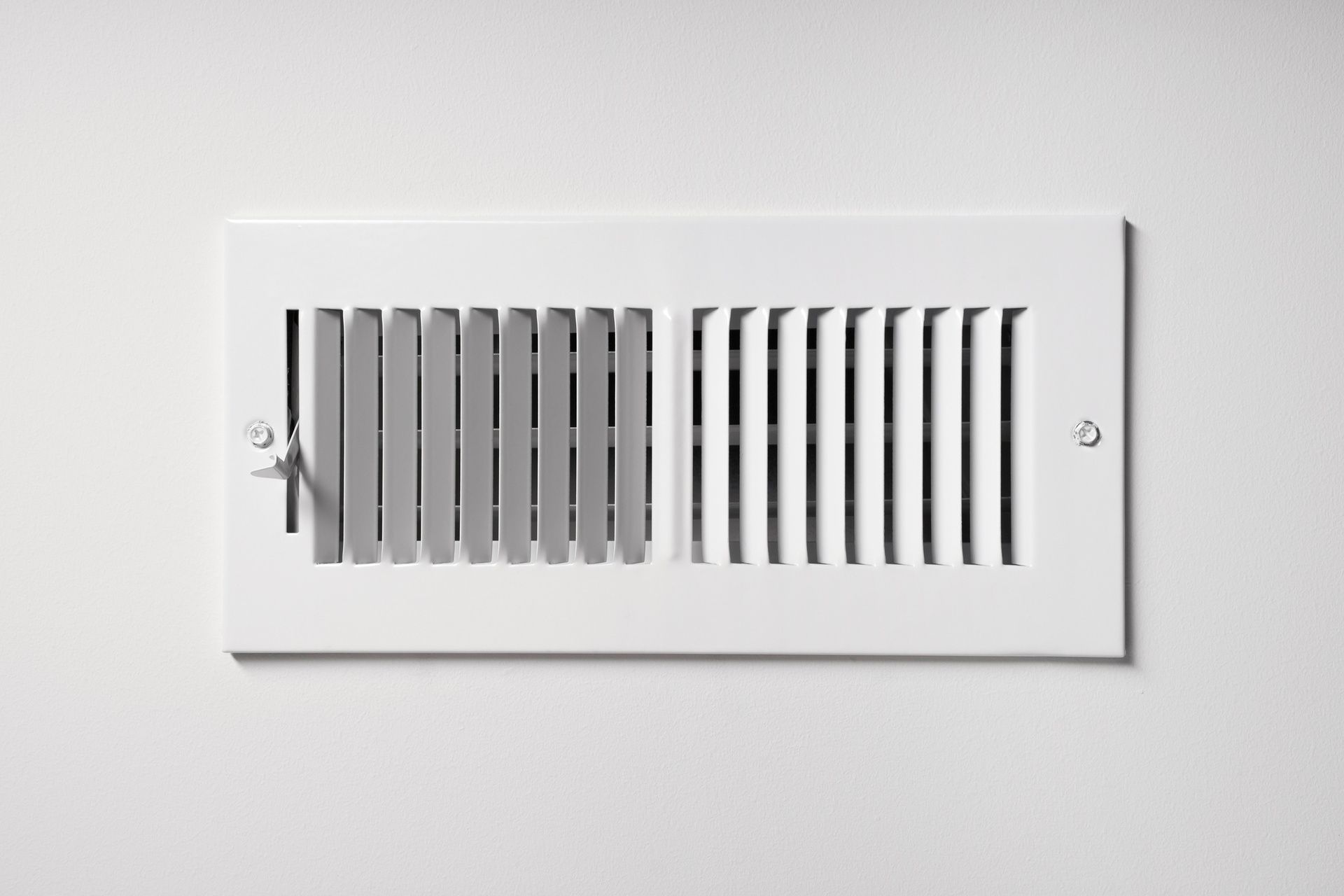 White wall vent cover with horizontal slats and side screws