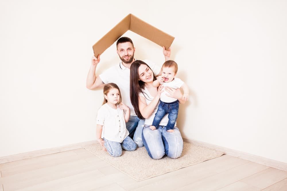Family kneel on a clean room — CCTV in Townsville