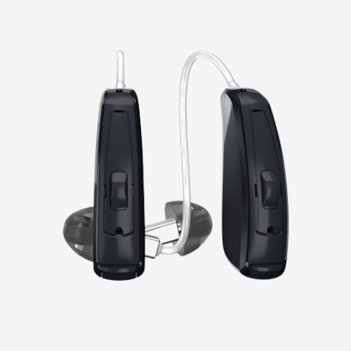 Two black behind-the-ear hearing aids with clear tubes and earmolds on a white background