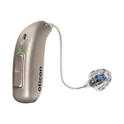 Behind-the-ear hearing aid with clear earpiece and silver casing