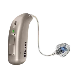Beige Oticon behind-the-ear hearing aid with clear earbud and curved wire