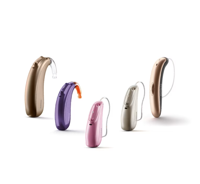 Five colorful behind-the-ear hearing aids on a white background