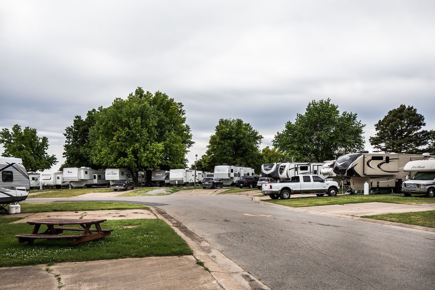 A row of rvs parked on the side of a road.