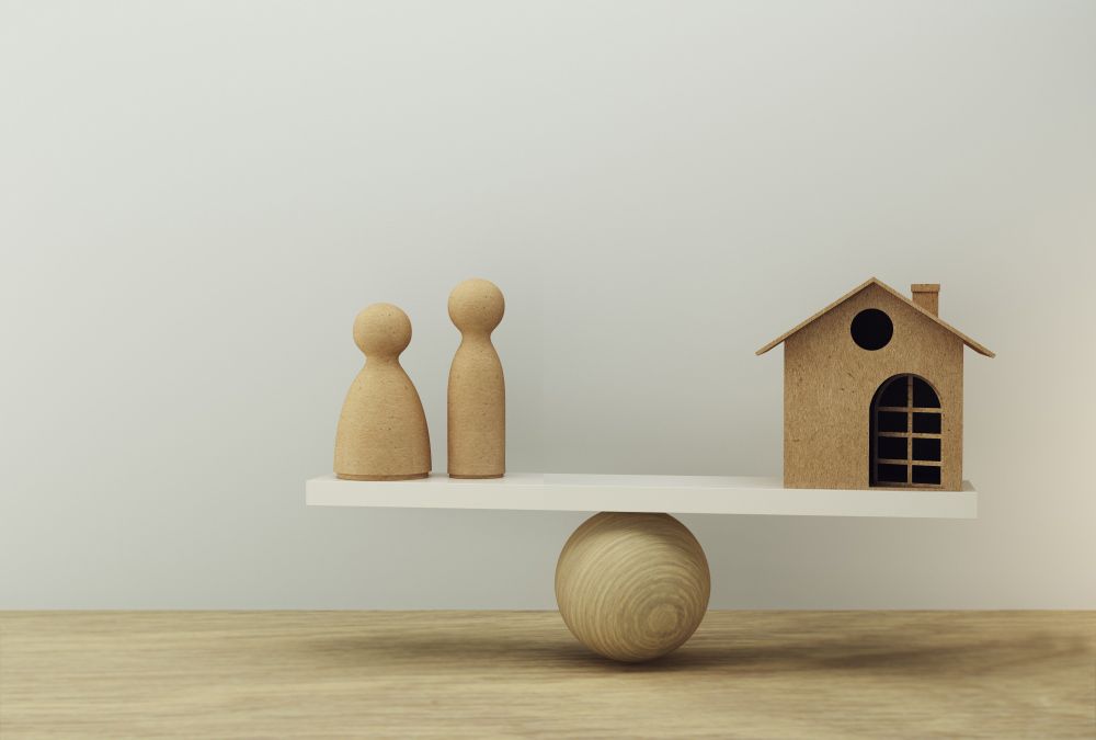 Family And House A Balance Scale In Equal Position — Clarence Property Consultants In Grafton, NSW