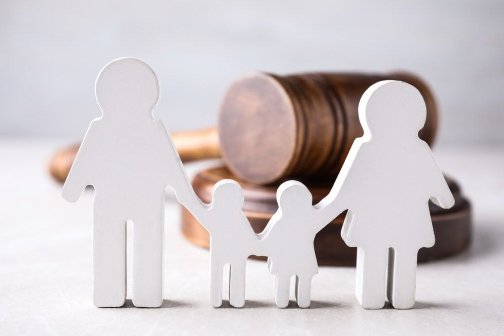Figure In Shape People And Wooden Gavel On Light Table — Clarence Property Consultants In Grafton, NSW