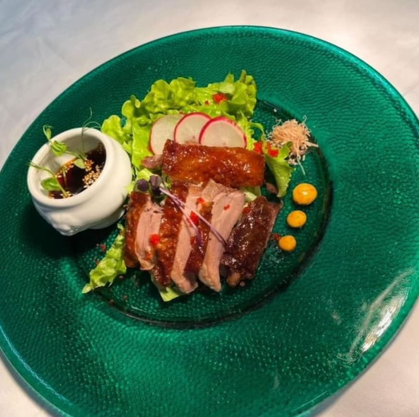 Meat dish in a green plate