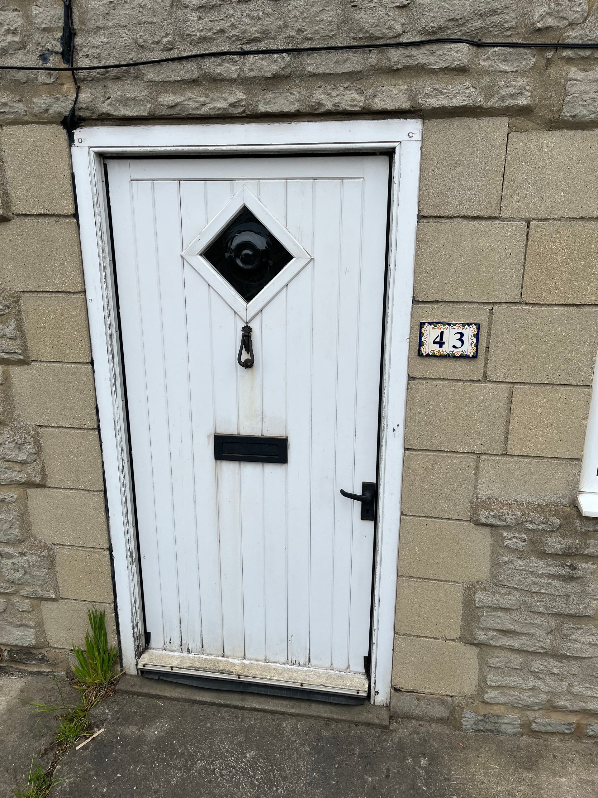 A white door with the number 43 on it