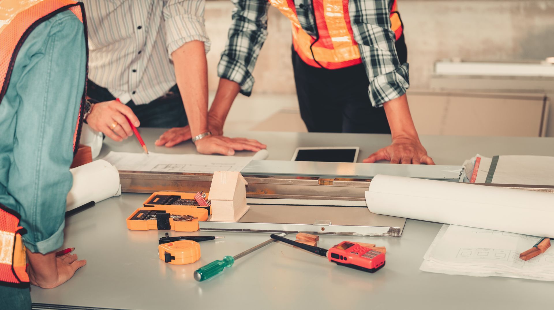 A group of people working on a table | Commercial Property Construction| Kotze Co