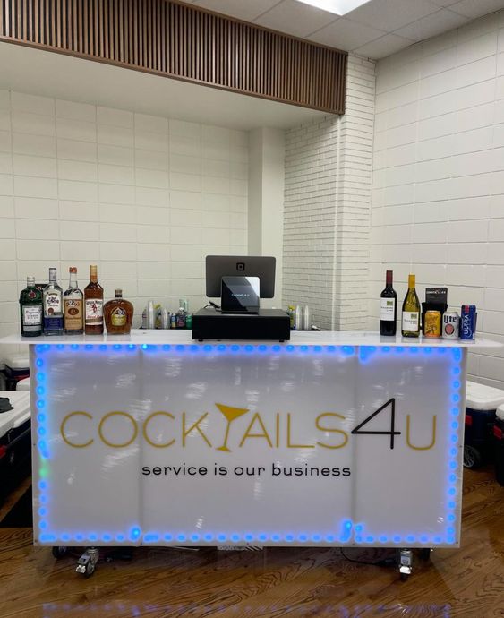 A bar that says cocktails4u service is our business