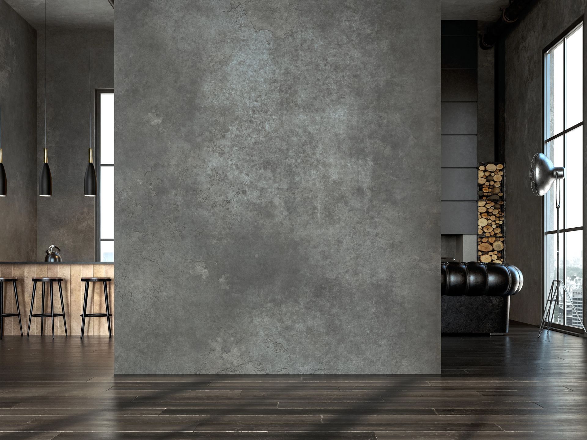 Interno moderno di una palestra in stile industriale con pareti in cemento, pavimento in legno scuro, sgabelli da bar e palle da ginnastica vicino a una finestra.