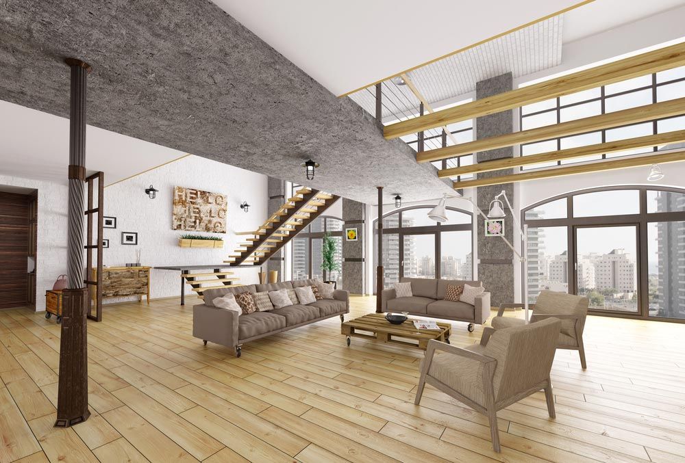 A Living Room With a Couch, Chairs, Coffee Table and Stairs — Timbertop Floor Sanding & Polishing In Cairns, QLD