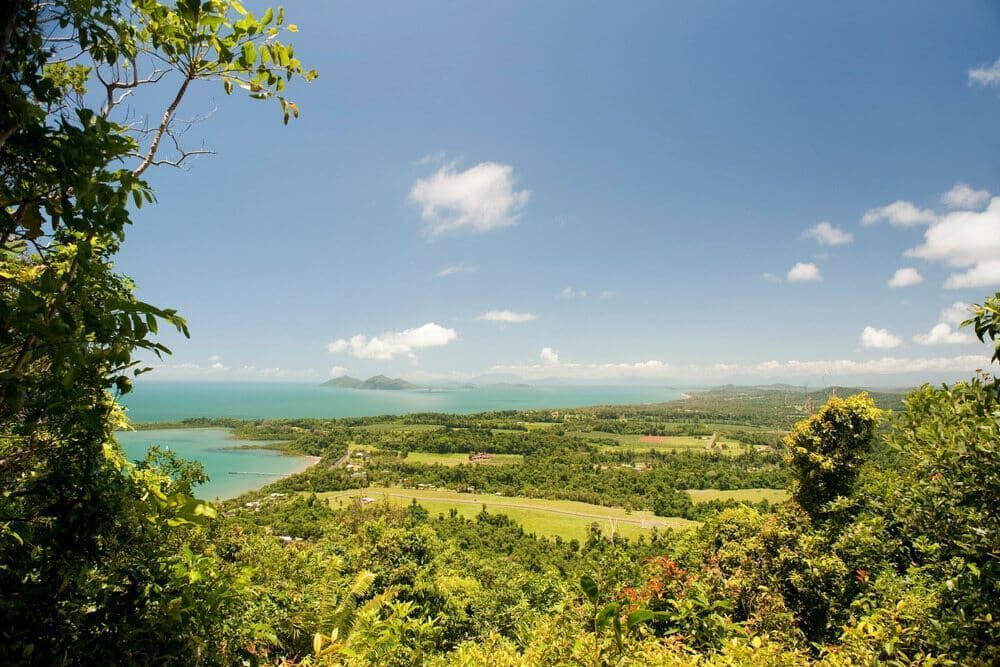 A View of a Green Landscape With a Body of Water — Timbertop Floor Sanding & Polishing In Cassowary Coast, QLD