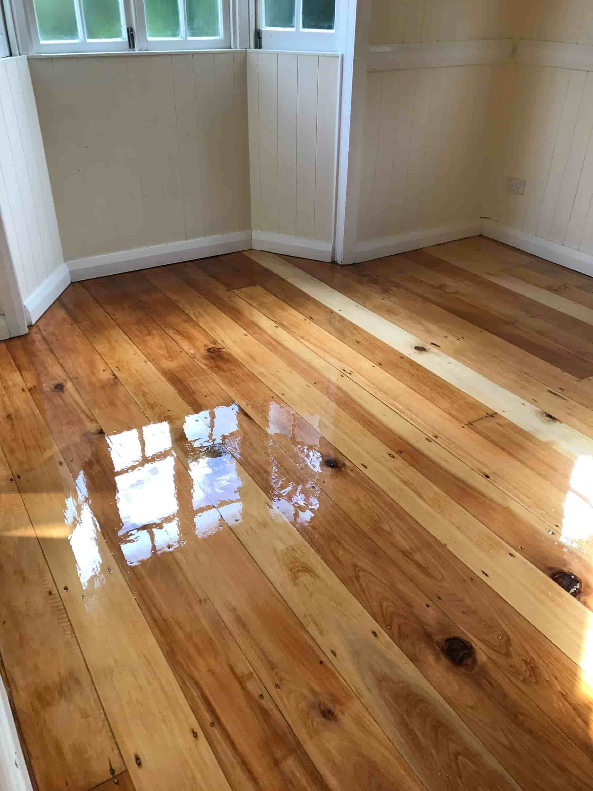 A Room With a Wooden Floor and a Window — Timbertop Floor Sanding & Polishing In Bungalow, QLD
