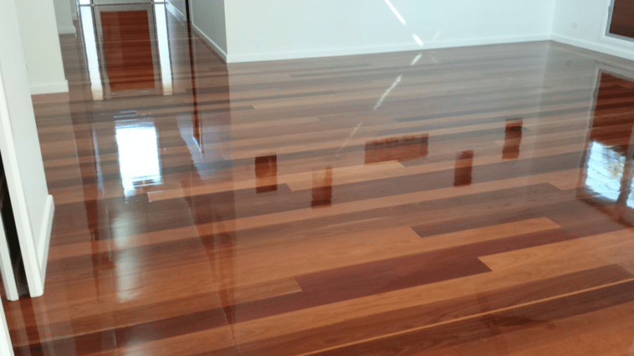 Shiny Wooden Floor Reflecting Rooms — Timbertop Floor Sanding & Polishing In Bungalow, QLD