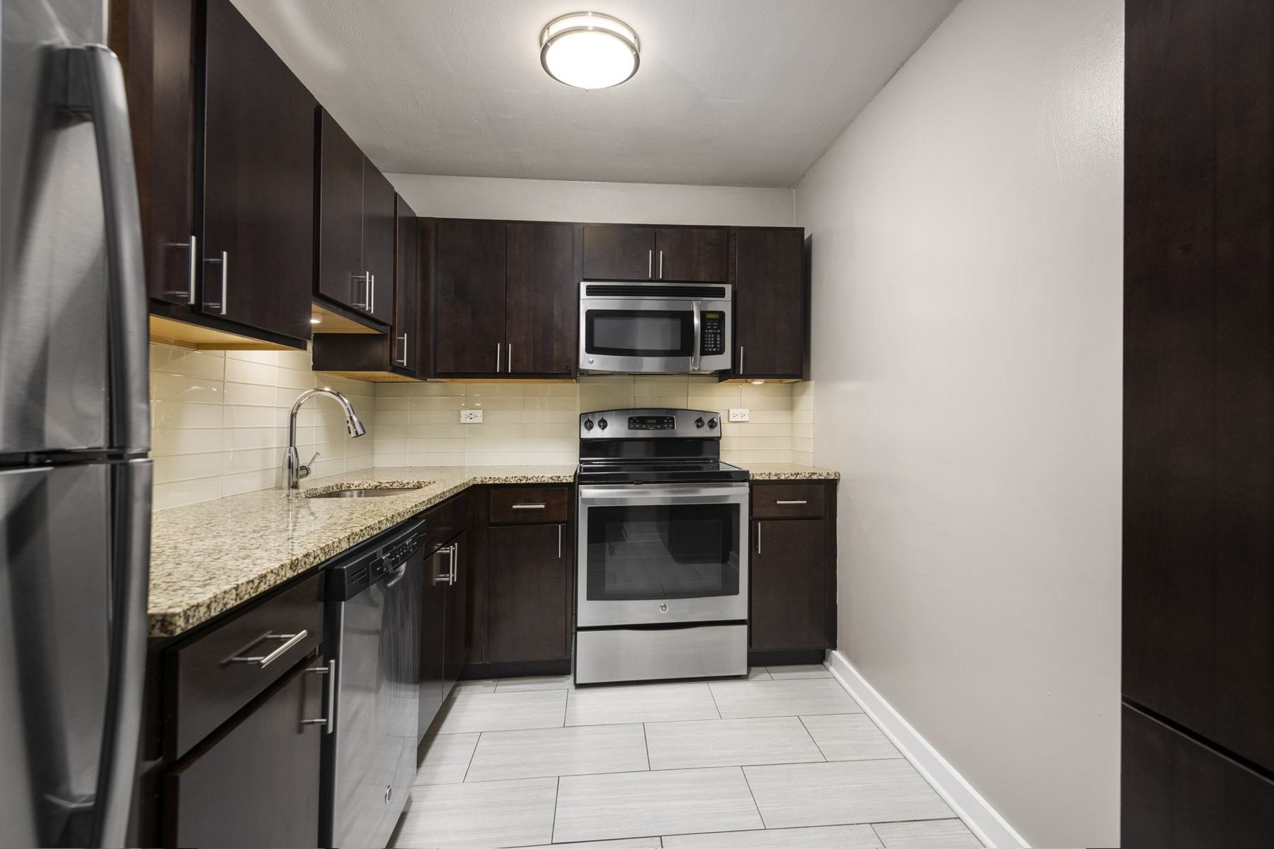 Kitchen at Park Lincoln with Brown Cabinets