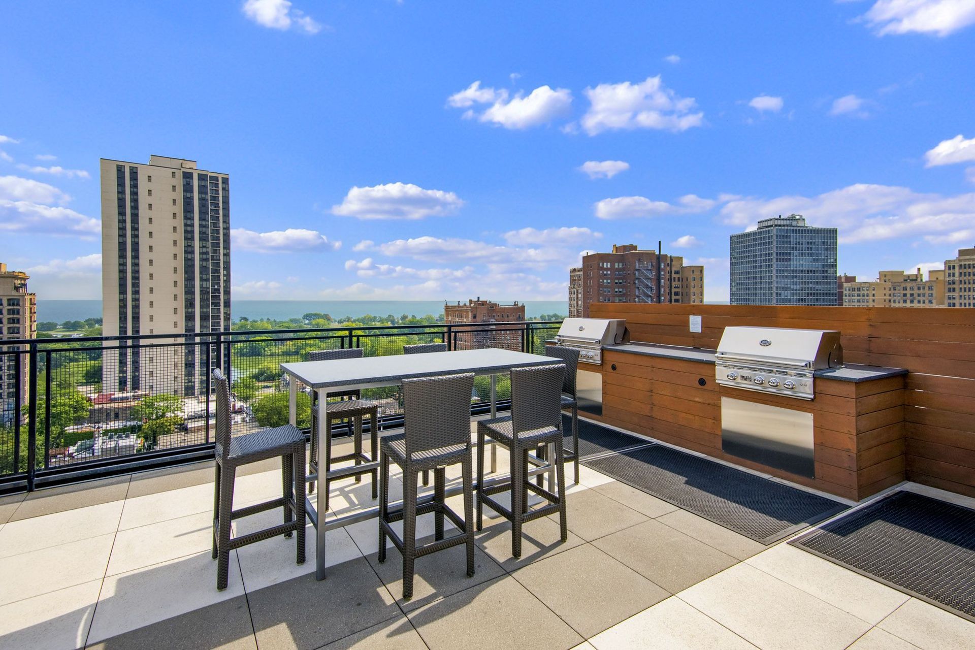 Rooftop at Park Lincoln with Table and Chairs, Grill and View of the Lake