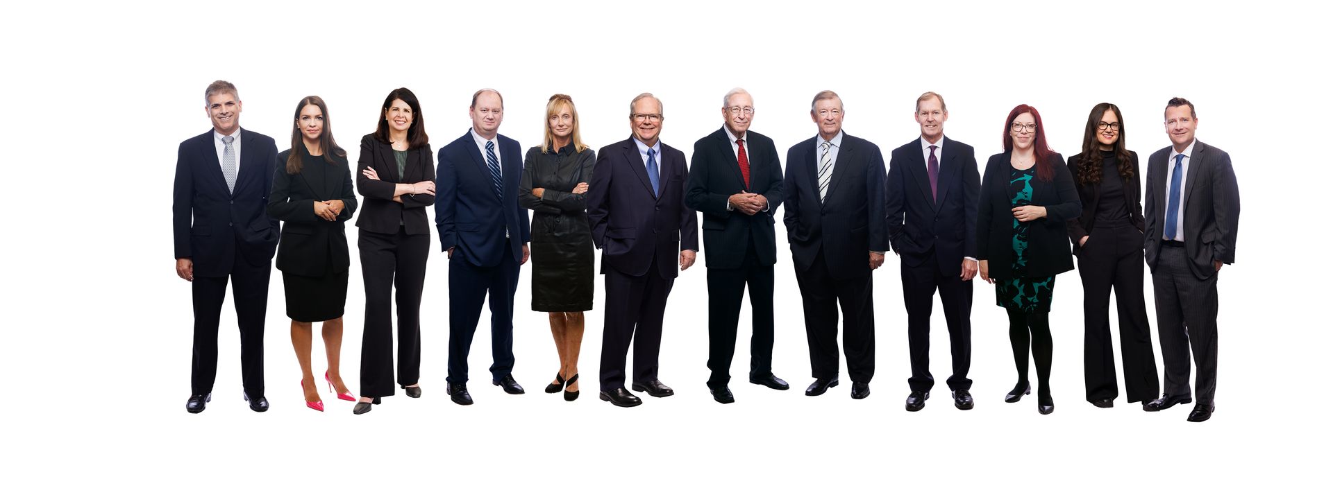 A group of people in suits and ties are standing in a row