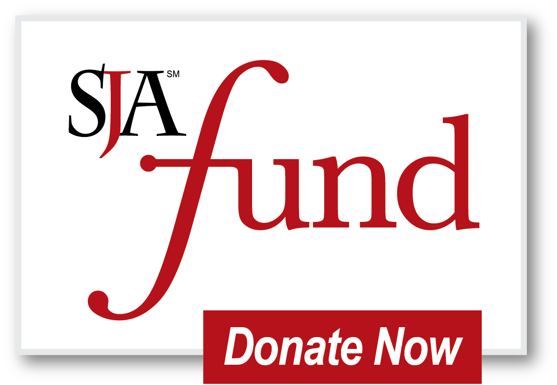 A sign that says donate now on it