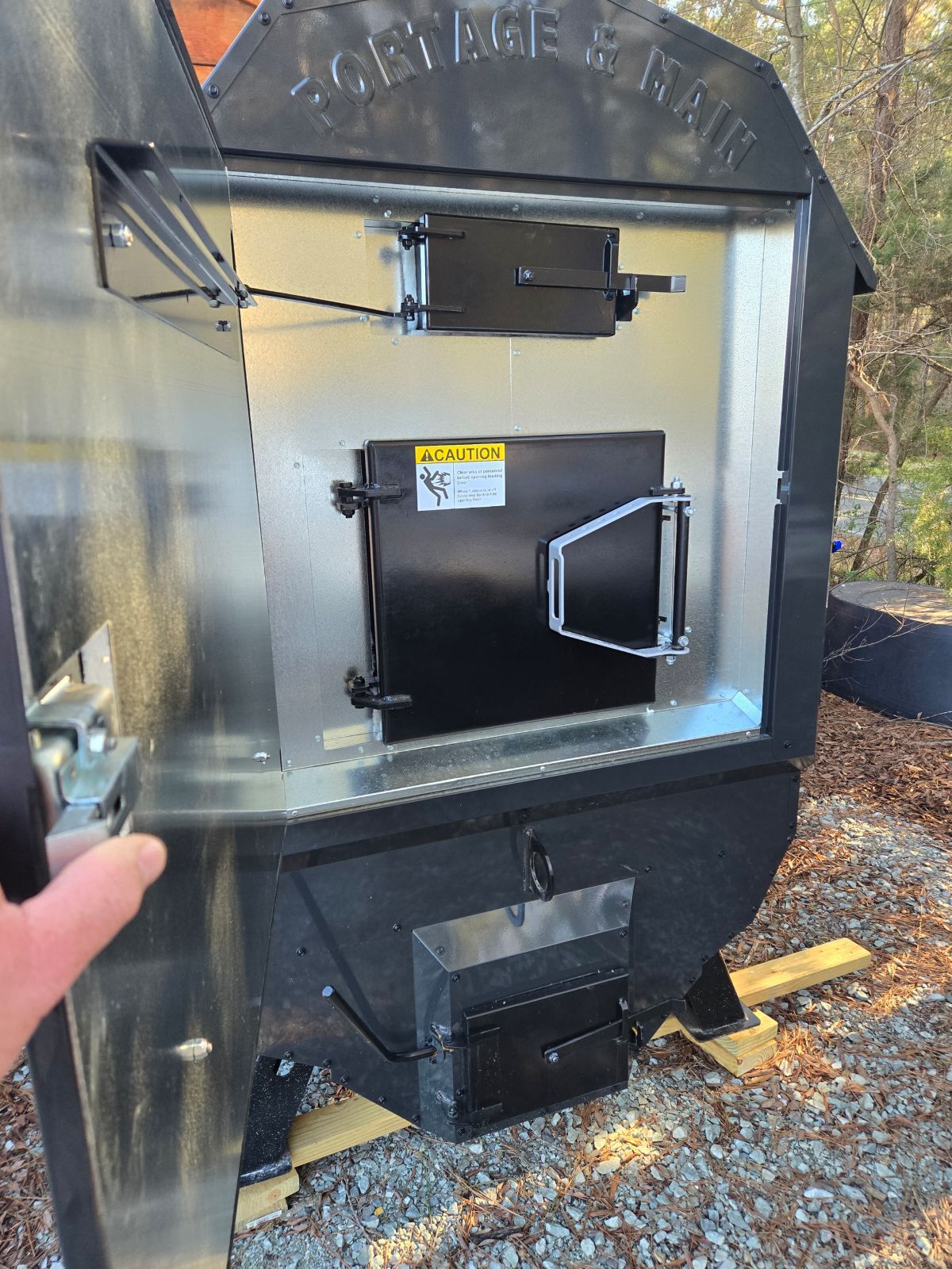 inner doors of the woodstove are protected from the elements by the insulated exterior door