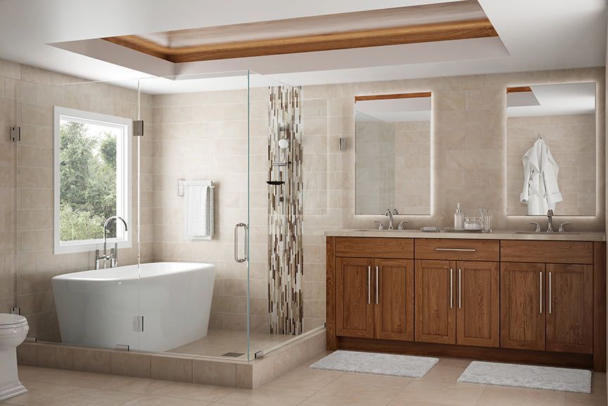 A bathroom with a bathtub , sinks , mirrors and a walk in shower.
