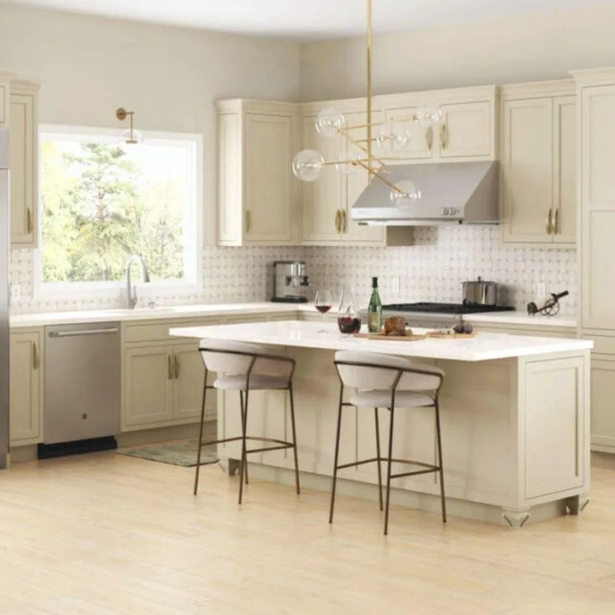 A kitchen with a large island and two stools