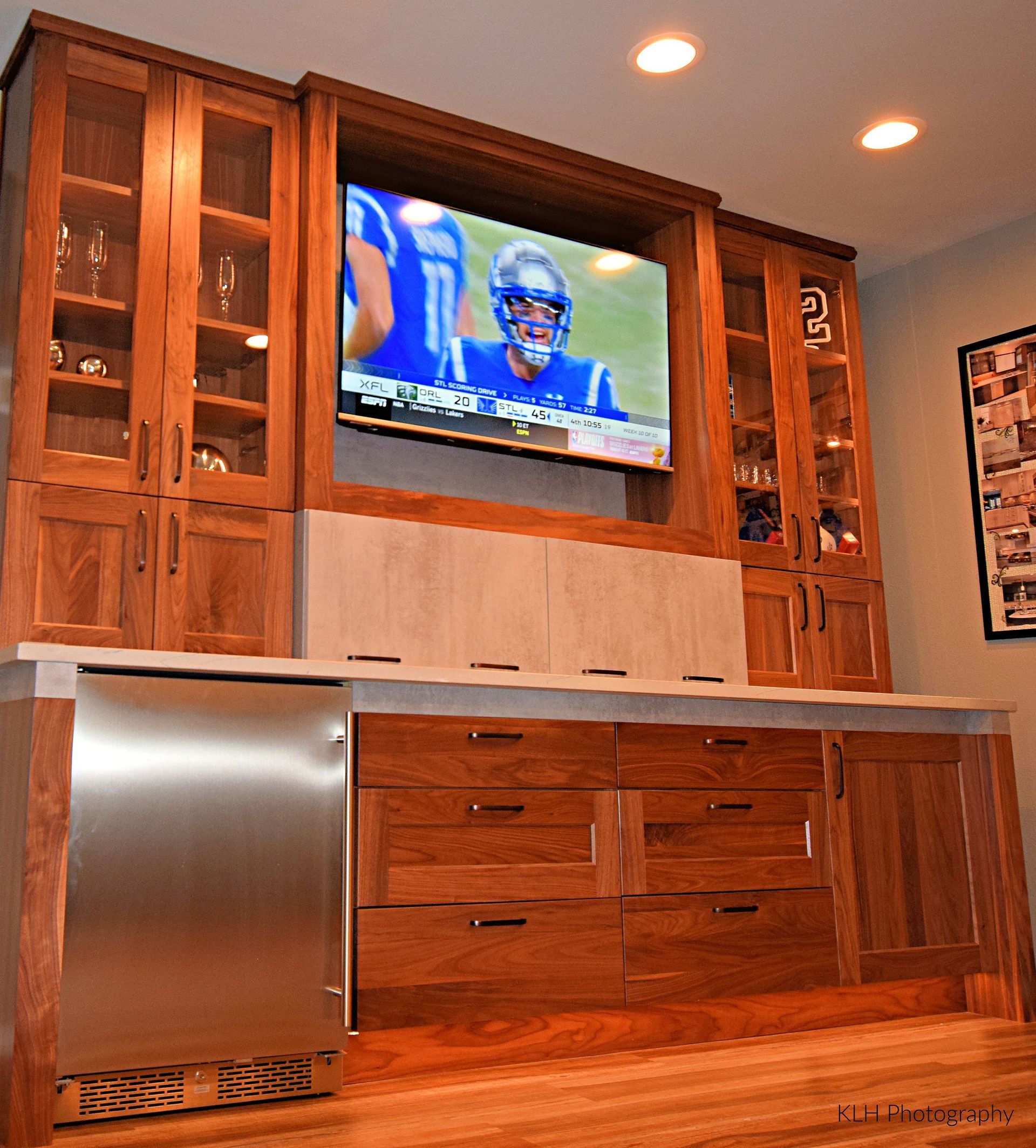 A football game is being played on a flat screen tv