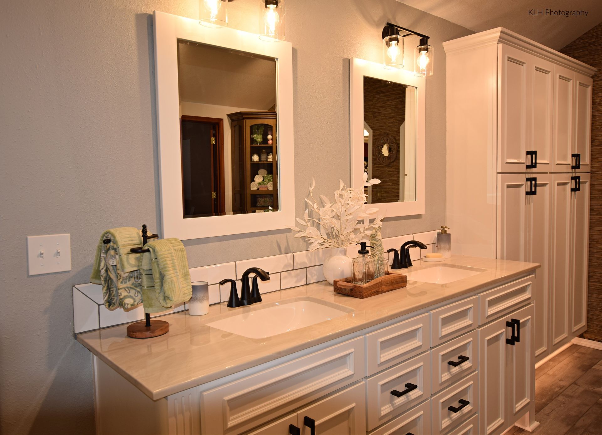 A bathroom with two sinks and two mirrors.
