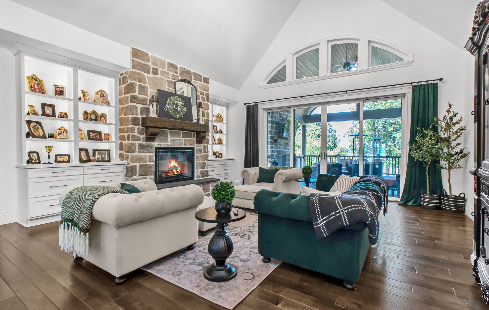 A living room filled with furniture and a fireplace.