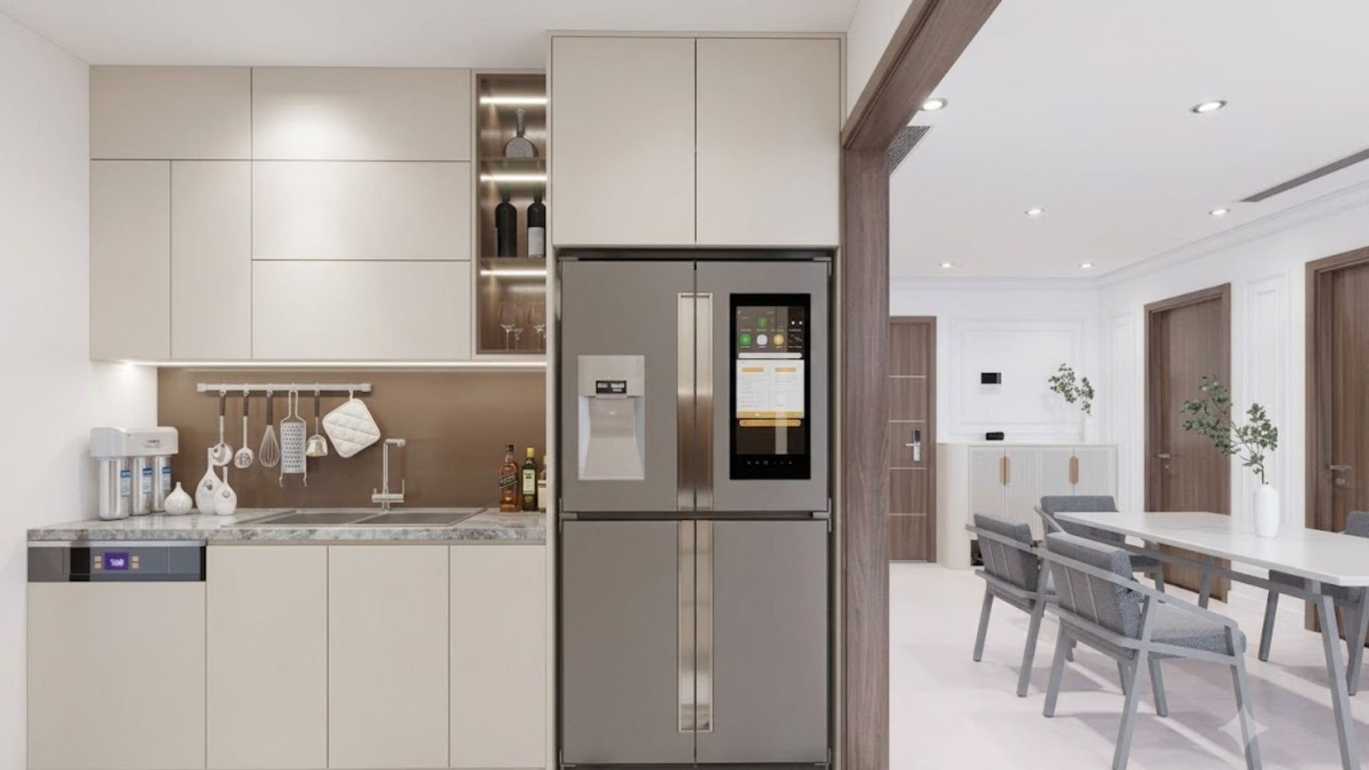 Modern open-plan kitchen with light cabinets, stainless steel refrigerator, and dining area beyond.