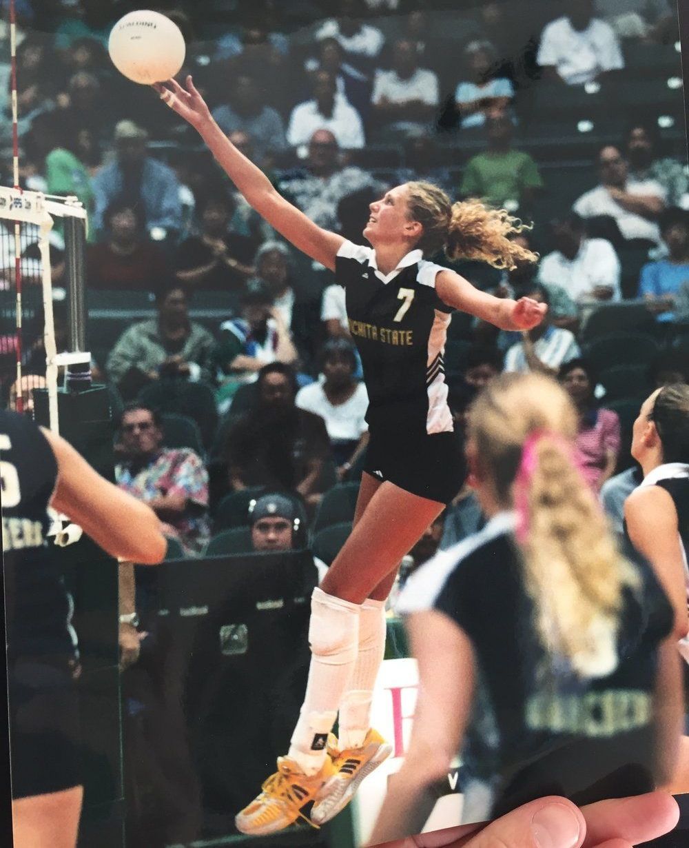 A volleyball player with the number 7 on her jersey