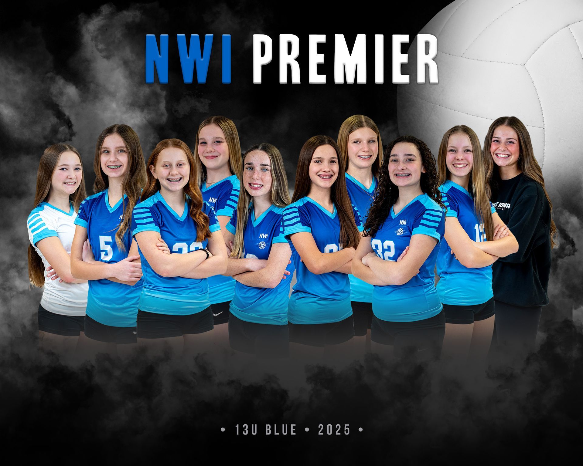 A group of girls are posing for a picture on a volleyball court.