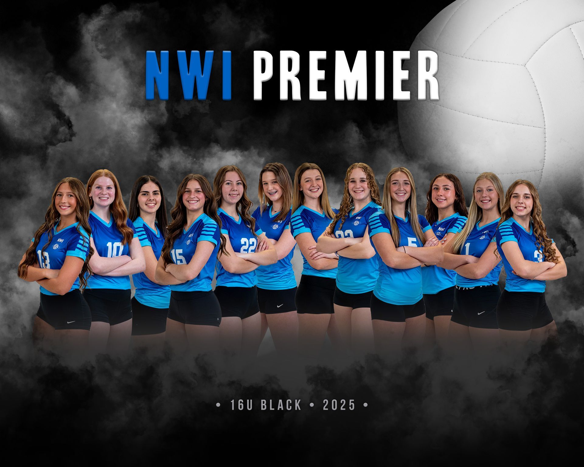 A volleyball team is posing for a picture in a gym.