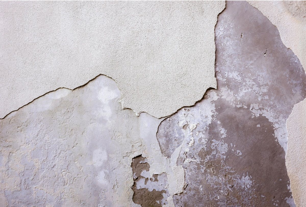 Interior wall showing drywall cracks and damage in a Tulare home