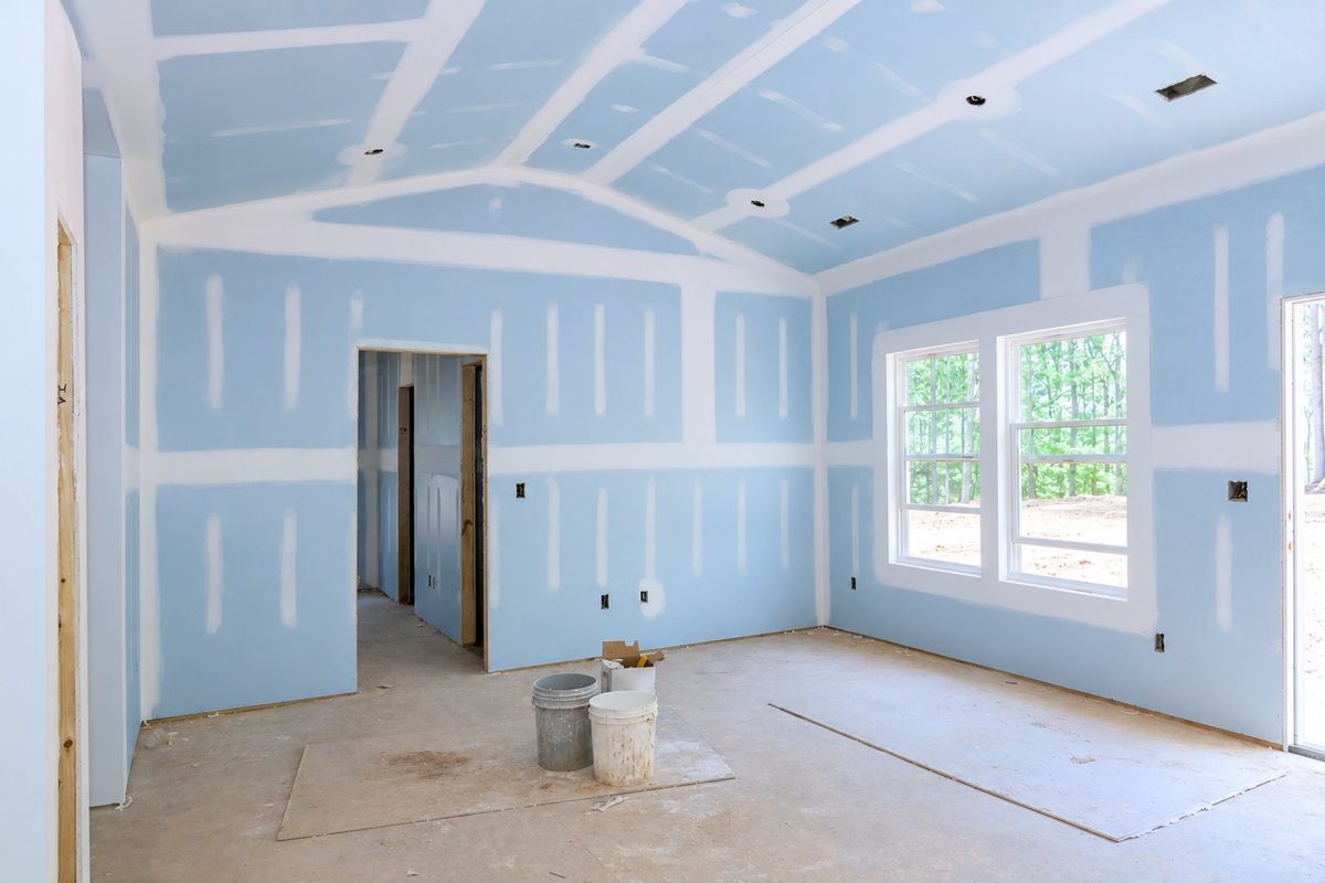 Drywall finishing in progress with smooth wall preparation inside a Tulare home